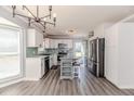 Modern kitchen with stainless steel appliances, an island, and white cabinets at 4101 Carson Dr, Sanford, NC 27332