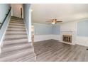 Cozy living room featuring hardwood floors, a fireplace, and ample natural light at 4101 Carson Dr, Sanford, NC 27332
