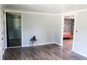 Inviting living space with modern wood-grain floors, neutral walls and open doorways to additional rooms at 411 Rainey Dr, Spring Lake, NC 28390