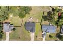 Aerial view of home showing large yard, trees, and surrounding neighborhood at 145 Tower Dr, Broadway, NC 27505