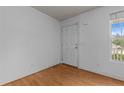 Neutral room with hardwood floors, window, and interior door at 182 Gunner Ct, Broadway, NC 27505
