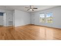 Open concept living room with hardwood floors, ceiling fan and lots of natural light at 182 Gunner Ct, Broadway, NC 27505