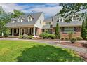 Traditional brick home with well-maintained landscaping, featuring a cozy front porch and classic architectural details at 2508 Brighton Pt, Sanford, NC 27330