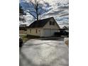 A detached two-car garage is featured, offering ample space for parking and storage, with an adjacent parking pad at 2847 Pickard Rd. Rd, Sanford, NC 27330