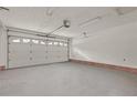 Spacious two-car garage featuring white walls, red trim, and overhead lighting at 40 Blue Heron Ct, Sanford, NC 27332
