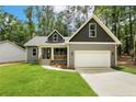 Attractive single-Gathering home featuring a two-car garage, covered porch, and pristine lawn at 5115 Cardinal Cir, Sanford, NC 27332