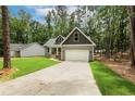 Well-maintained single-Gathering house with a two-car garage and a manicured lawn at 5115 Cardinal Cir, Sanford, NC 27332
