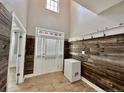Bright foyer with shiplap wall, decorative window above door and tiled floors at 110 Citadel St, Cameron, NC 27326