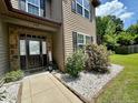 Inviting front entrance with stone accents and charming landscaping around the home at 110 Citadel St, Cameron, NC 27326