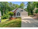 Charming single-Gathering home featuring a well-manicured lawn, two-car garage, and brick accents at 1397 Colorado Trl, Sanford, NC 27332