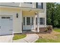 Inviting front entrance featuring a white door with glass panes and classic sidelights at 221 Culpepper Rd, Cameron, NC 28326