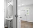 Bathroom featuring modern vanity with an oval mirror and neutral colors at 254 Angel Oak Dr, Bunnlevel, NC 28323