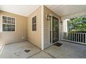 Covered entry porch featuring outdoor lighting at 1432 Ponderosa Trl, Cameron, NC 28326
