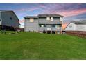 Spacious backyard with a well-maintained lawn, a patio area, and privacy fencing at 24 Carter Dr, Sanford, NC 27332