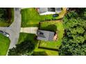 Aerial view showcasing the backyard with its wooden fence and the home's surroundings at 3229 Seth Dr, Sanford, NC 27330