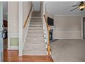 Welcoming foyer with hardwood floors and a staircase leading to the upper level at 34 Westchester Ln, Angier, NC 27501