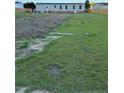 The backyard features a spacious lawn enclosed by a wooden fence at 92 Rad St, Lillington, NC 27546