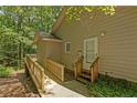 Exterior view of a home featuring a ramp and stairs leading to a side door at 3070 Still Turn, Sanford, NC 27332