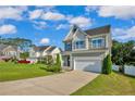 Beautiful two-story home with well-kept lawn and attached two car garage, nestled in a Gathering-friendly neighborhood at 786 Century Dr, Cameron, NC 28326