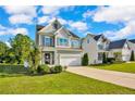 Well-maintained two-story home featuring a pristine lawn and attached two car garage at 786 Century Dr, Cameron, NC 28326