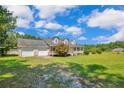 Charming home featuring a welcoming front porch and a spacious two-car garage at 1862 Nc 87 S, Cameron, NC 28326