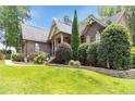 Gorgeous home with lush green lawn and elegant stone accents at 3027 Carrington Ln, Sanford, NC 27330