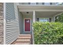 Charming entrance with a brick stoop, stylish front door, and well-maintained landscaping at 442 Kentucky Derby Ln, Lillington, NC 27546