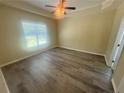 Bright bedroom with large window and ceiling fan for comfort at 138 Gold Ct, Broadway, NC 27505