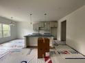 Bright, eat-in kitchen with new cabinetry and hardwood floors, ready to be finished to your taste at 158 Travelers Ct, Lillington, NC 27546