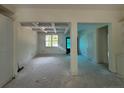 Open-concept living area with coffered ceiling at 27 Lookout Pt, Sanford, NC 27332