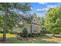 Well-maintained home surrounded by lush greenery, enhancing privacy and natural beauty at 530 Anderson Creek Dr, Spring Lake, NC 28390