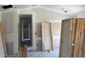 A home under construction with white walls, multiple doors, and a concrete floor at 5964 Godwin Lake Rd, Benson, NC 27504