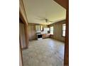 Functional kitchen with essential appliances, light cabinetry, and a ceiling fan at 410 W K St, Erwin, NC 28339