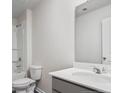 Clean and bright bathroom with a single sink vanity and a shower-tub combo at 518 Stadium Drive, Cameron, NC 28326
