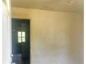 Entryway featuring light-colored walls and a view into an adjacent room through an open doorway at 644 Moores Chapel Rd, Lillington, NC 27546