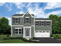 Two-story house with gray siding, white trim, and a two-car garage at 137 Tormore Dr, Sanford, NC 27330