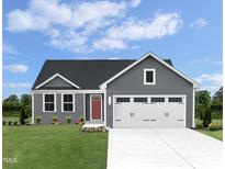 Charming gray home featuring a well-manicured lawn and a two-car garage at 356 N Coral Bells Way Way, Four Oaks, NC 27524