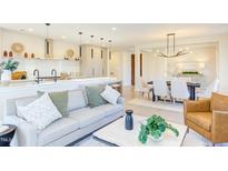 Bright living room features a modern open floor plan connecting living, dining, and kitchen spaces at 600 N Roxboro St # 24, Durham, NC 27701