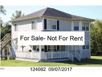 Two-story home featuring a covered porch and exterior staircase access to the second floor at 2913 Wadsworth Ave, Durham, NC 27707