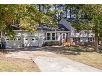 Gray house with two-car garage and landscaped yard at 403 Carpenter Fletcher Rd, Durham, NC 27713