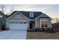 New construction home with neutral siding and a two-car garage at 150 Sawtooth Oak Lane, Youngsville, NC 27596