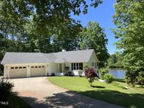 Charming single-story home with a two-car garage and waterfront views at 3309 Westcott Cir, Sanford, NC 27330