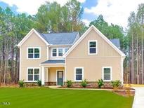 Charming two-story home with a manicured lawn and inviting curb appeal at 73 Artic Cir, Garner, NC 27529