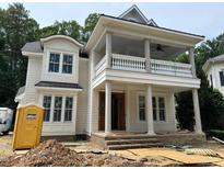 An in-progress exterior elevation of a home featuring a double porch with columns and detailed trim at 8305 Society Pl, Raleigh, NC 27615