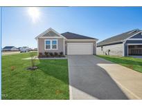 New single-story home with driveway and landscaped lawn at 234 Chestnut Oak Ln, Lillington, NC 27546