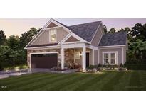 Craftsman style home with stone accents and a 2-car garage at 1005 Bridgeforth Ln, Chapel Hill, NC 27517