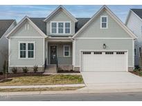 Two-story Craftsman home with gray siding, white trim, and a two-car garage at 205 Wash Hollow Dr, Wendell, NC 27591