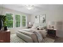 Bright bedroom with neutral tones, large windows, stylish decor, and a cozy, inviting atmosphere at 146 Wood Wedge, Sanford, NC 27332