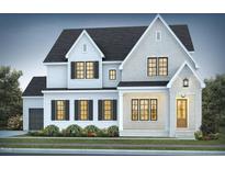 Charming two-story home featuring a mix of brick and white siding, complemented by black shutters and a well-maintained lawn at 162 Gaines Trail, Pittsboro, NC 27312