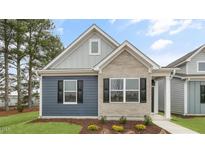Charming single-story home featuring a mix of brick and siding, and a well-manicured lawn at 791 Washington St, Fuquay Varina, NC 27526